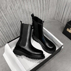 Sleek Black Leather Chelsea Boots for Women with Round Toe Pull Tab Lug Sole Platform Style